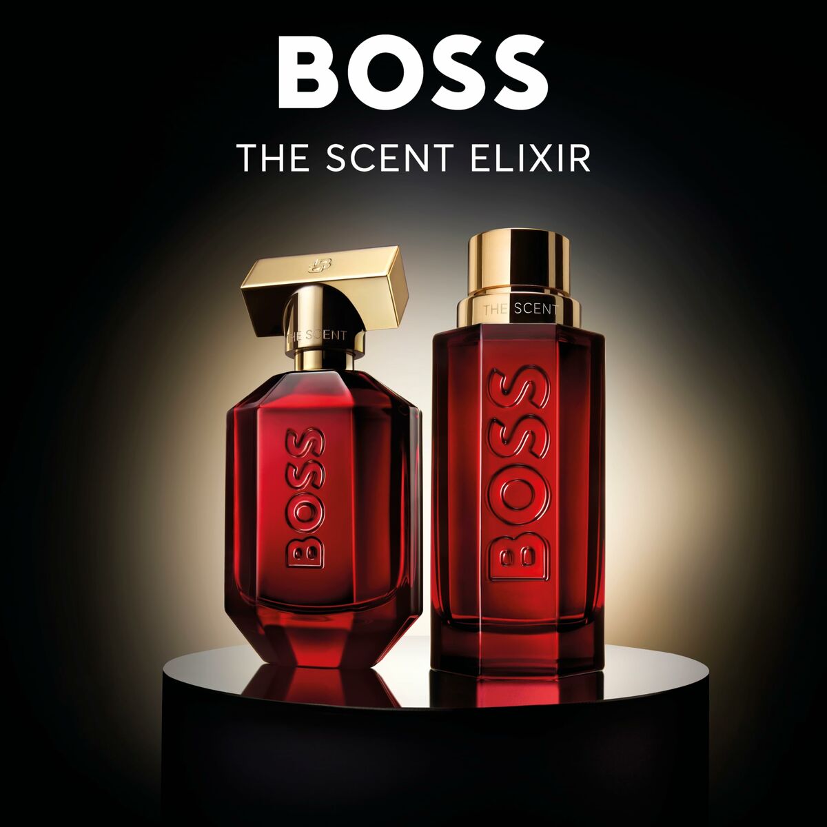 BOSS The Scent Elixir fragrance bottles displayed on a pedestal against a dark background.