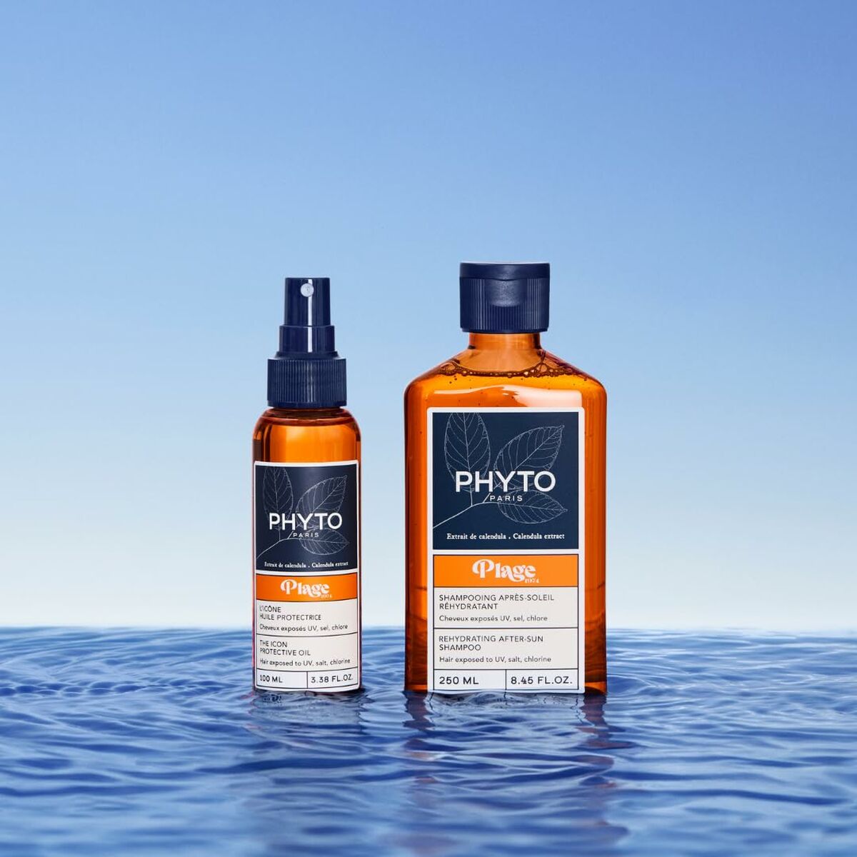 Shampooing Phyto Paris PLAGE with hydrating spray against a serene blue water background.